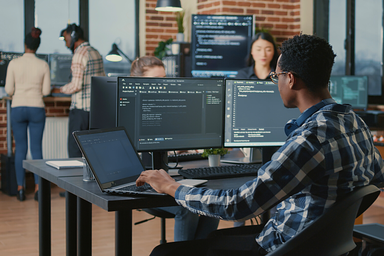 Group of IT security specialist monitoring a business network