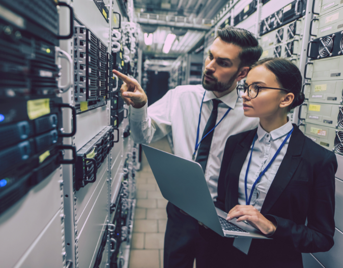 Sydney Managed IT Offers IT Security Management Colleagues doing an inspection on a server
